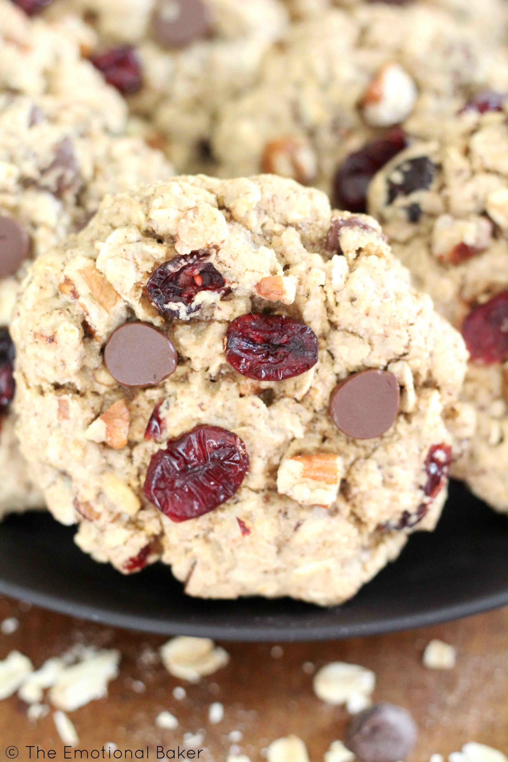 Cranberry Pecan Oat Cookies -- A guilt free cookie sweetened with maple syrup and packed with oats, cranberries, pecans, and chocolate!