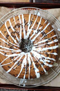 This Vegan Pumpkin Chocolate Chip Bundt Cake is perfectly spiced, filled with chocolate and topped with a simple icing.