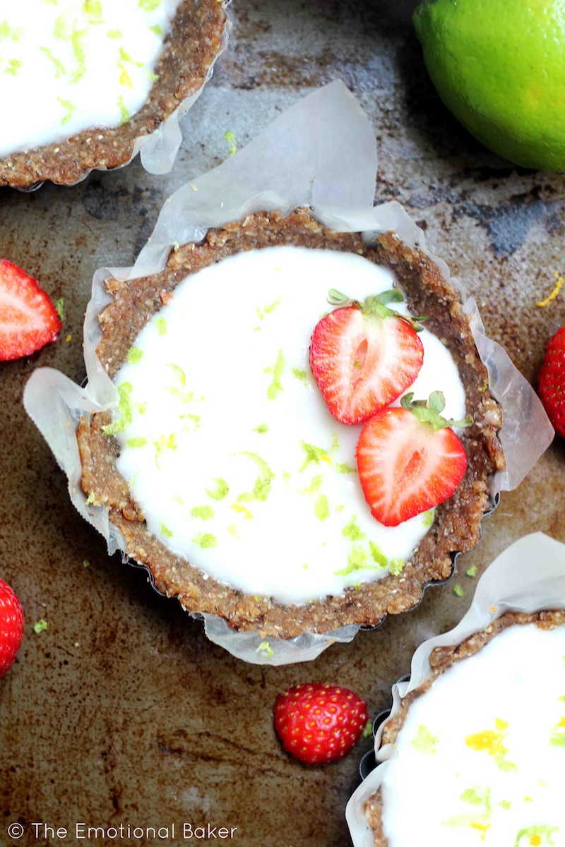 An easy and healthy key lime pie tart featuring a date crust and key lime yogurt