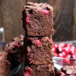 These Vegan Cranberry Brownies are the perfect combo of cake-y and fudge-y. They are loaded with fresh cranberries and chocolate!