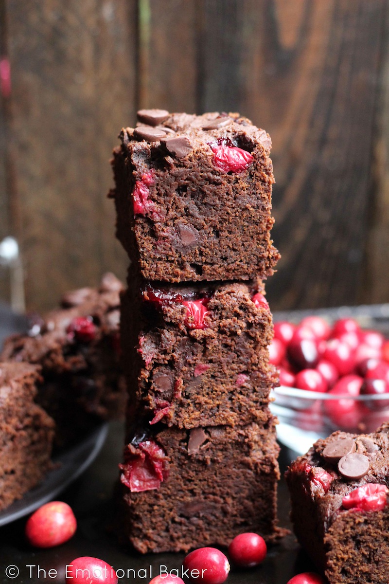 These Vegan Dark Chocolate Brownies are the perfect combo of cake-y and fudge-y. Loaded with fresh cranberries and chocolate, you'll certainly love these sweet bars!