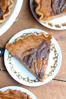 Overhead image of a slice of chocolate swirled pumpkin pie